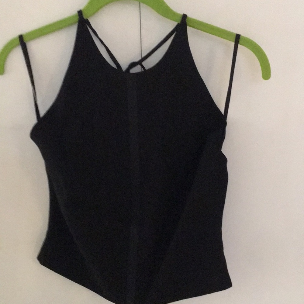 Moda International. Black shell w/satin down the front and ties at the neck.